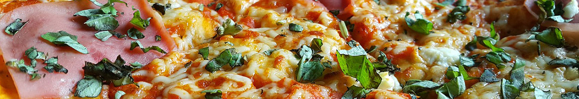 Eating Italian Pizza at Pizzatini restaurant in Hempstead, NY.